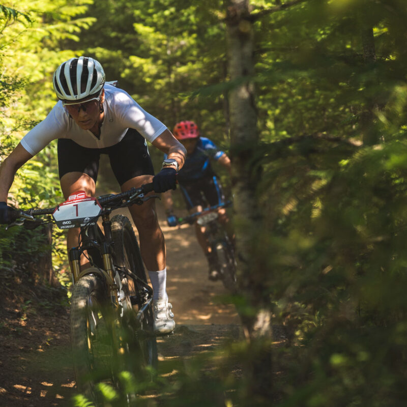 female mountain biker in a race