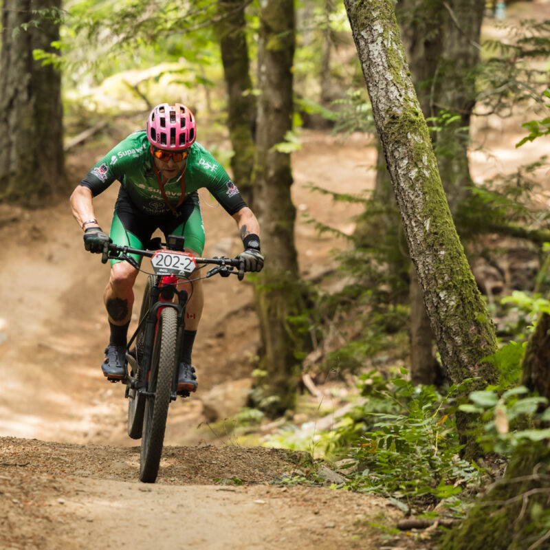 A racer on a section of flow trail at the BC Bike Race 2024